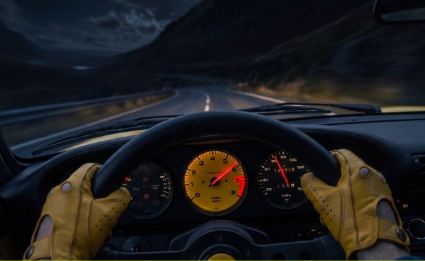 Porsche 911 R-Spec side profile parked in the dark pine forest mountain road